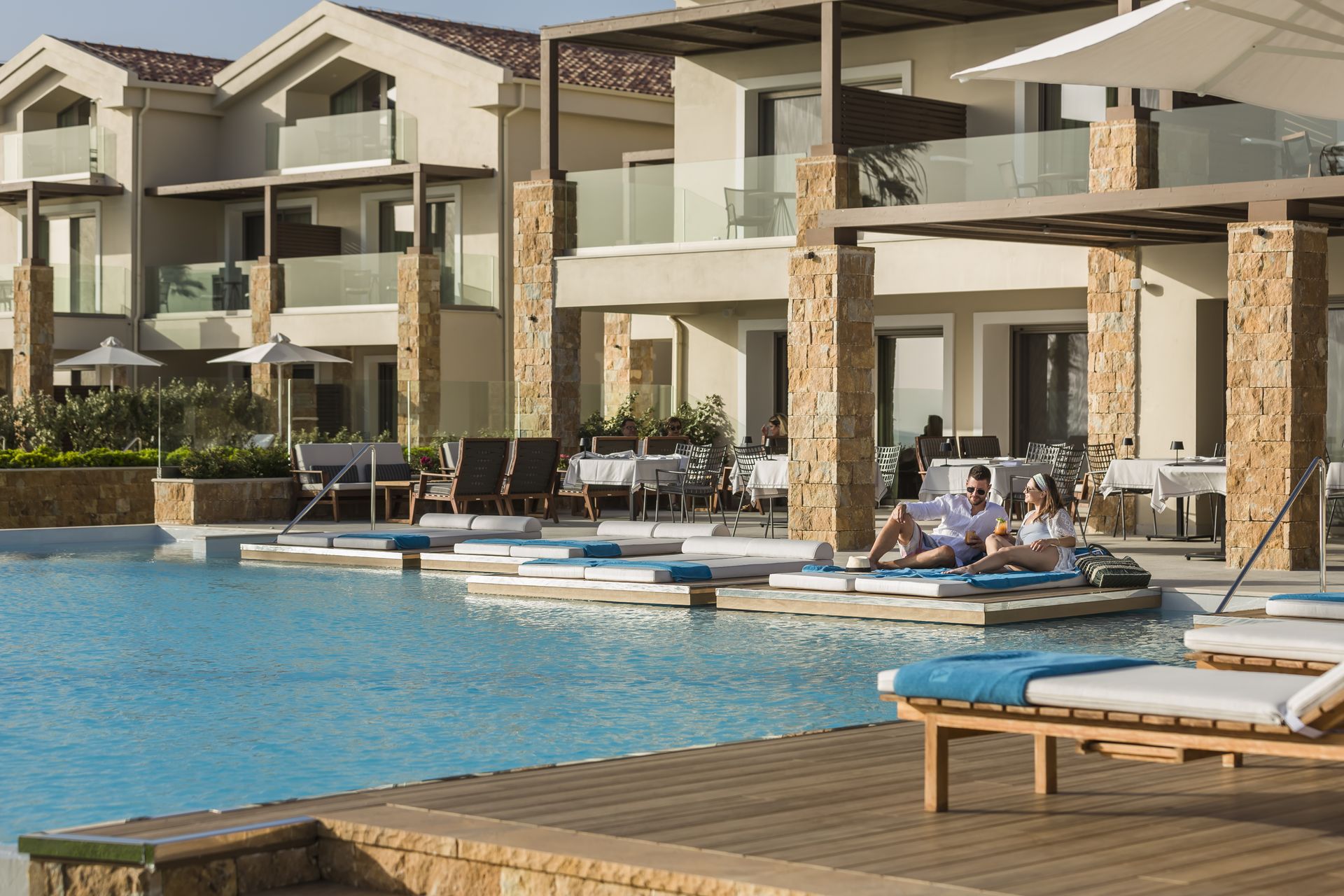 _electra_kefalonia_couple_relaxing_by_outdoor_pool_resized
