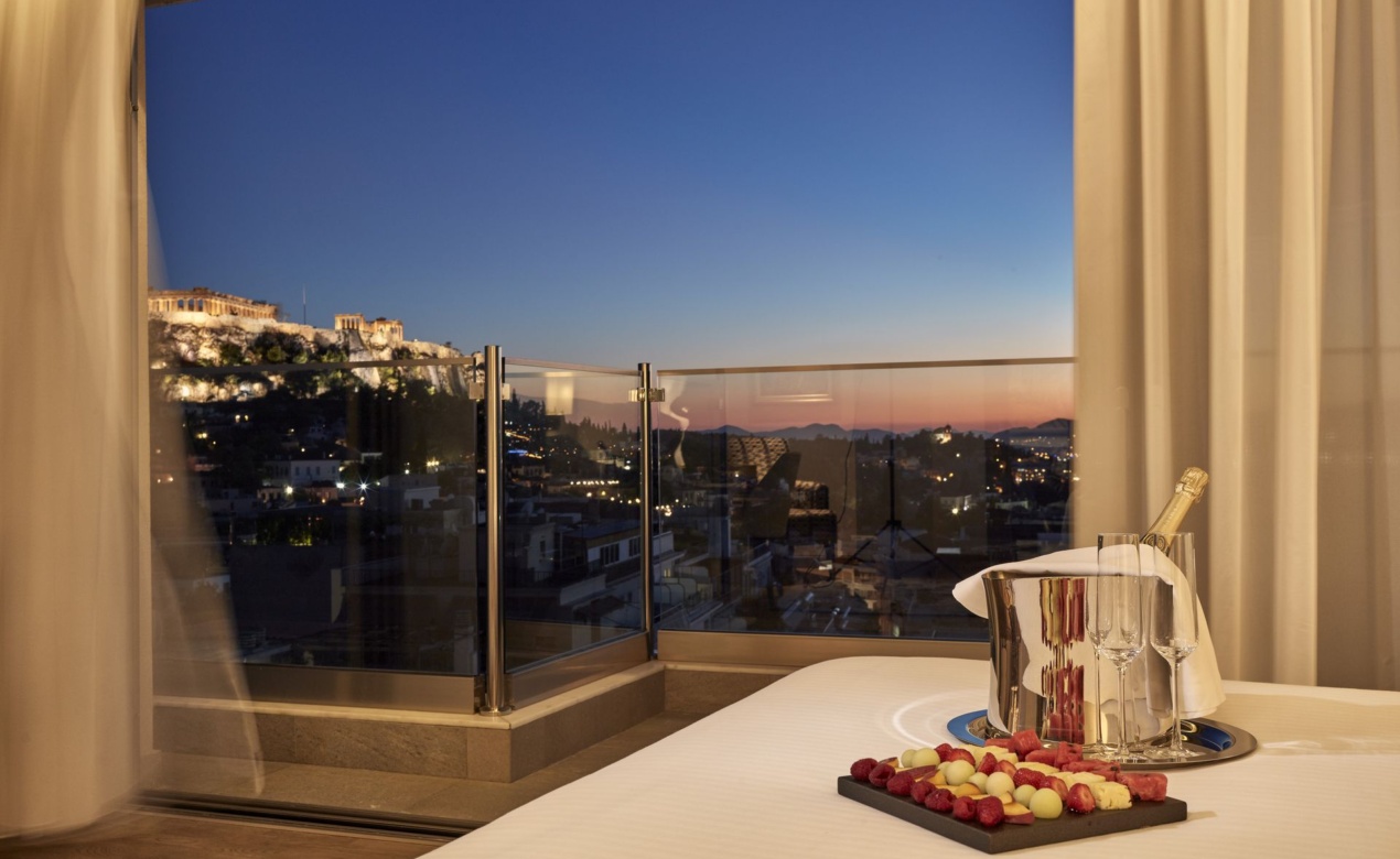 Evening view of the Acropolis from the Acropolis Suite at Electra Metropolis hotel in Athens, for your most romantic getaways in Greece's capital.