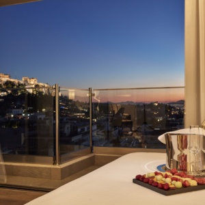 Evening view of the Acropolis from the Acropolis Suite at Electra Metropolis hotel in Athens, for your most romantic getaways in Greece's capital.