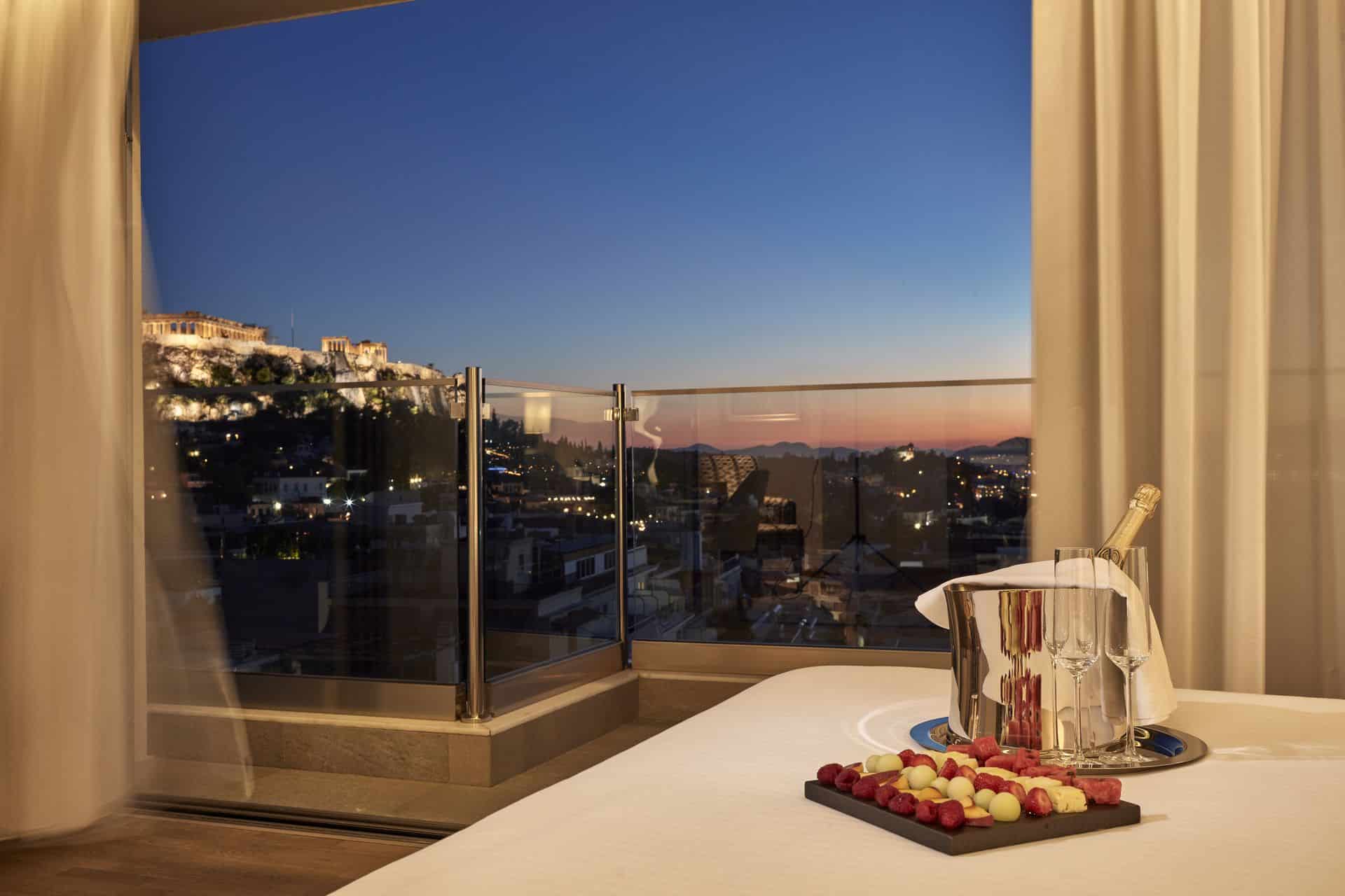 Evening view of the Acropolis from the Acropolis Suite at Electra Metropolis hotel in Athens, for your most romantic getaways in Greece's capital.