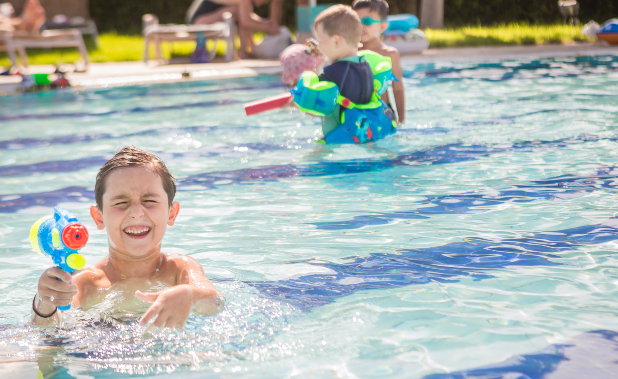 Kids havig the tie of their lives in the pool of our family friendly resorts in Greece at our Electra Palace Rhodes