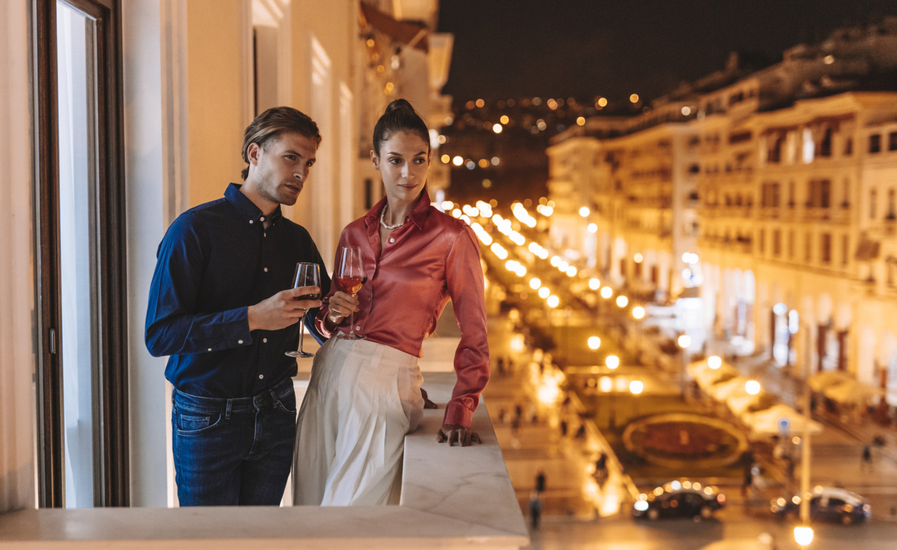 Couple on a balcony spending the perfect Valentine's day in Thessaloniki at Electra Hotels