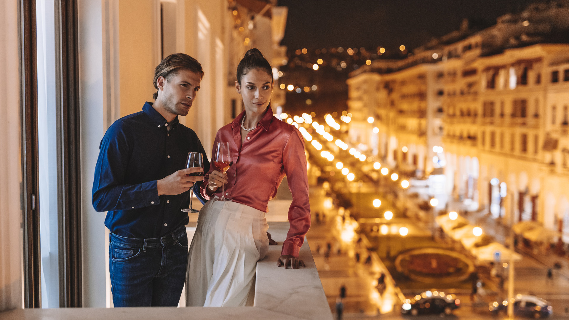 Couple on a balcony spending the perfect Valentine's day in Thessaloniki at Electra Hotels