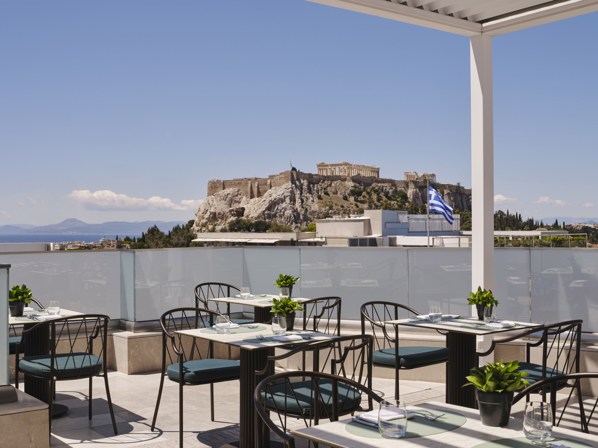 The Acropolis view rooftop of Electra Rhythm Athens’ restaurant – a stylish Athens city hotel designed for modern travellers seeking comfort, culture, and urban energy.