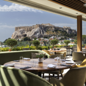 The setting for enjoying gourmet Athens cuisine with Acropolis views at Electra Palace Athens hotel’s rooftop.
