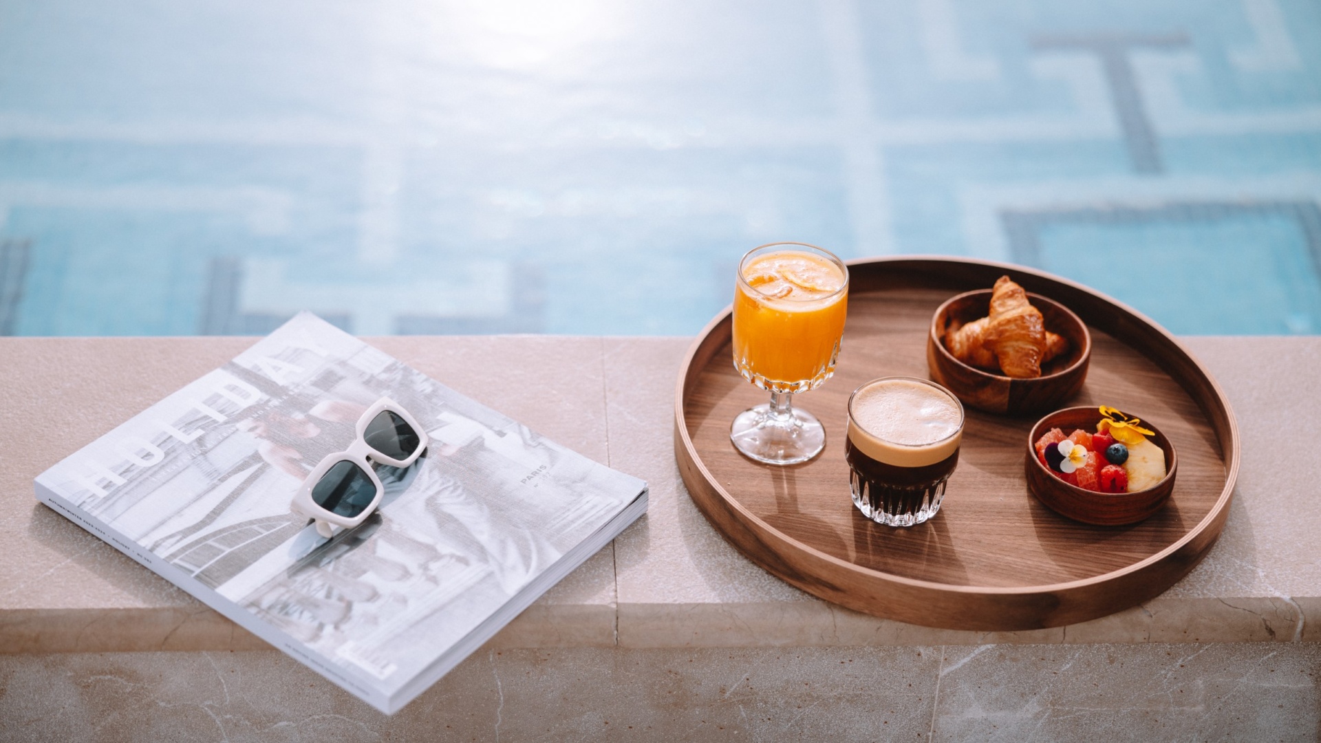 Breakfast tray by the pool at Electra Hotels, a top choice for those in search of wellness hotels in Athens city