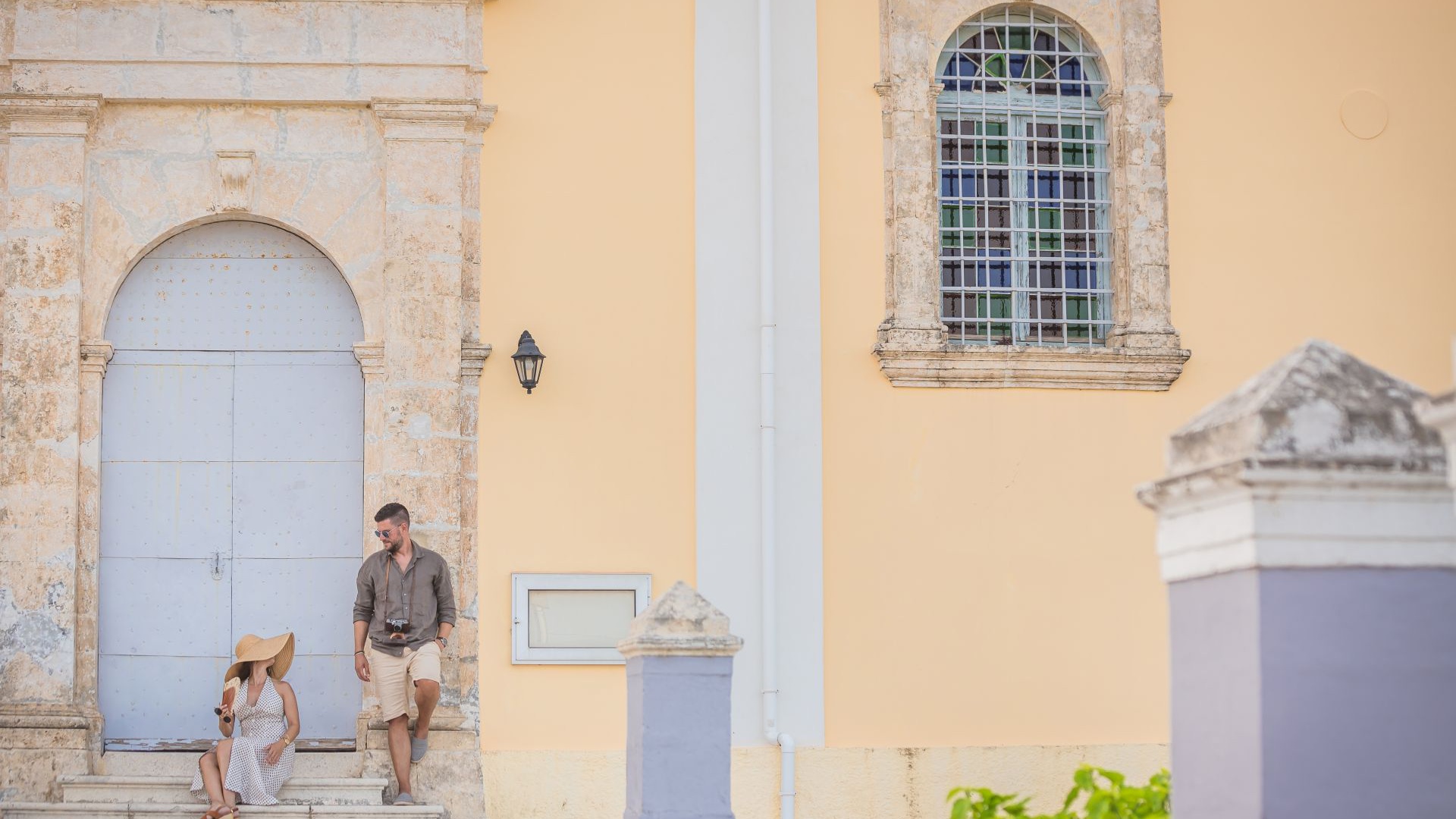 Couple pictured at the entrance of a mansion during their trip to Kefalonia in autumn.